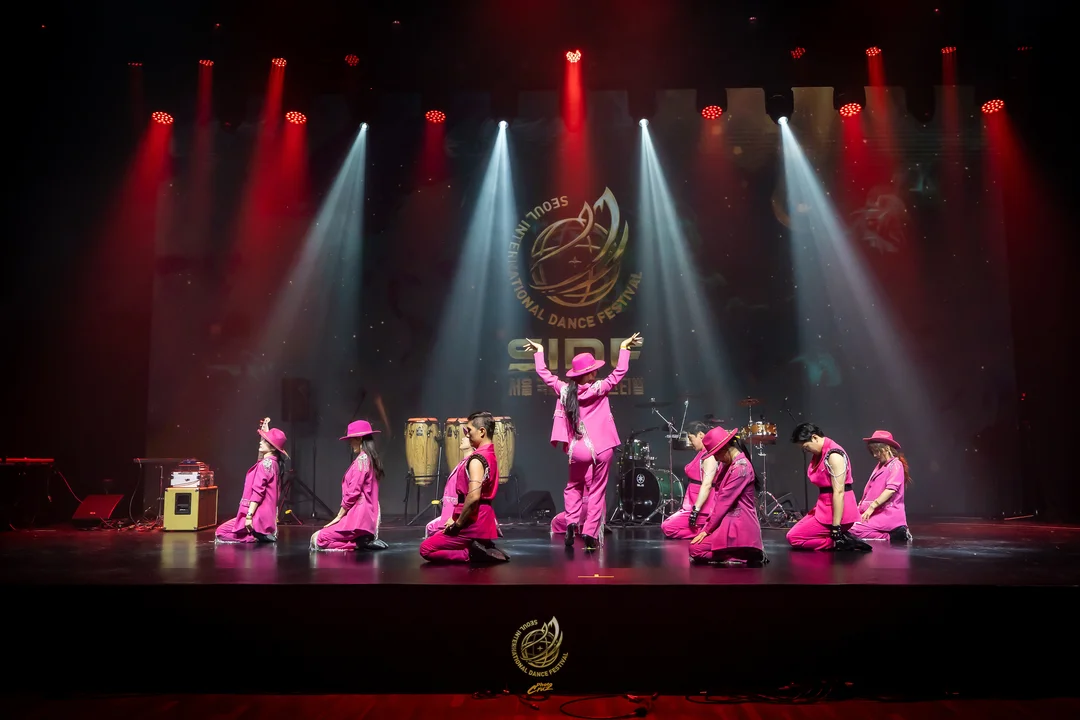 A team dancing on stage during the SIDF 2026 Saturday performance